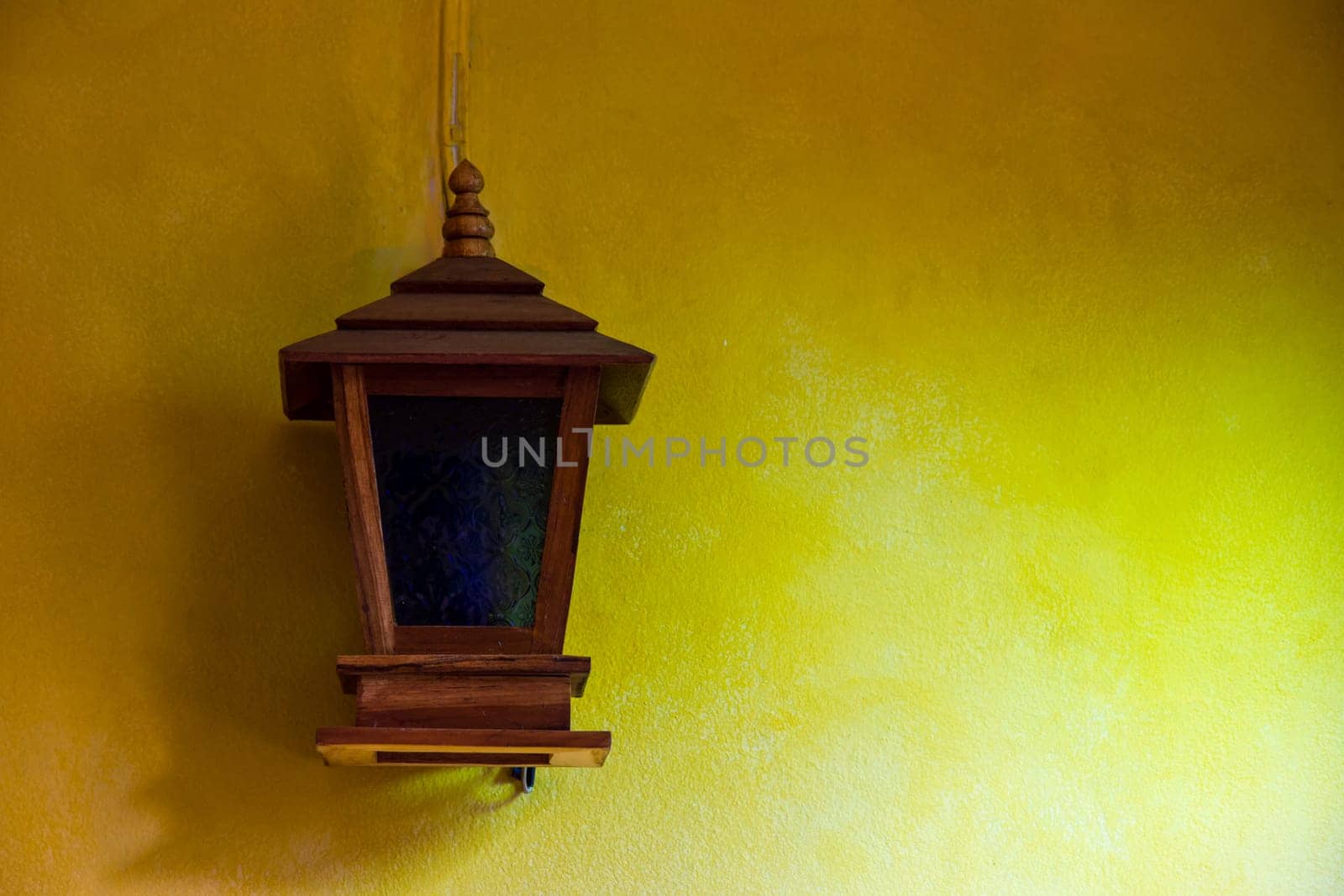 Lantern on a yellow wall vintage design