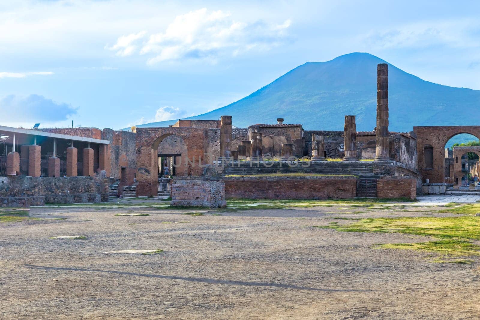 Pompeii in Italy, ruins of the antique Temple of Apollo with bronze Apollo statue, Naples.