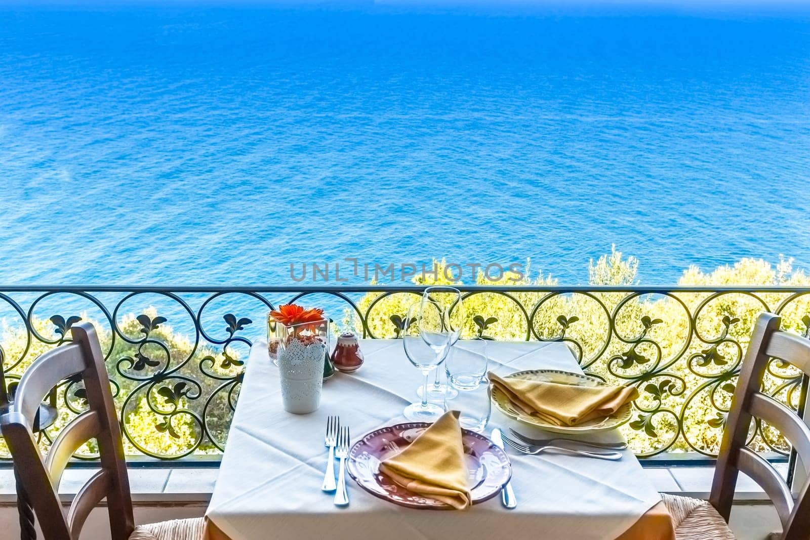 Restaurant table overlooking the sea on the Amalfi coast in Italy.
