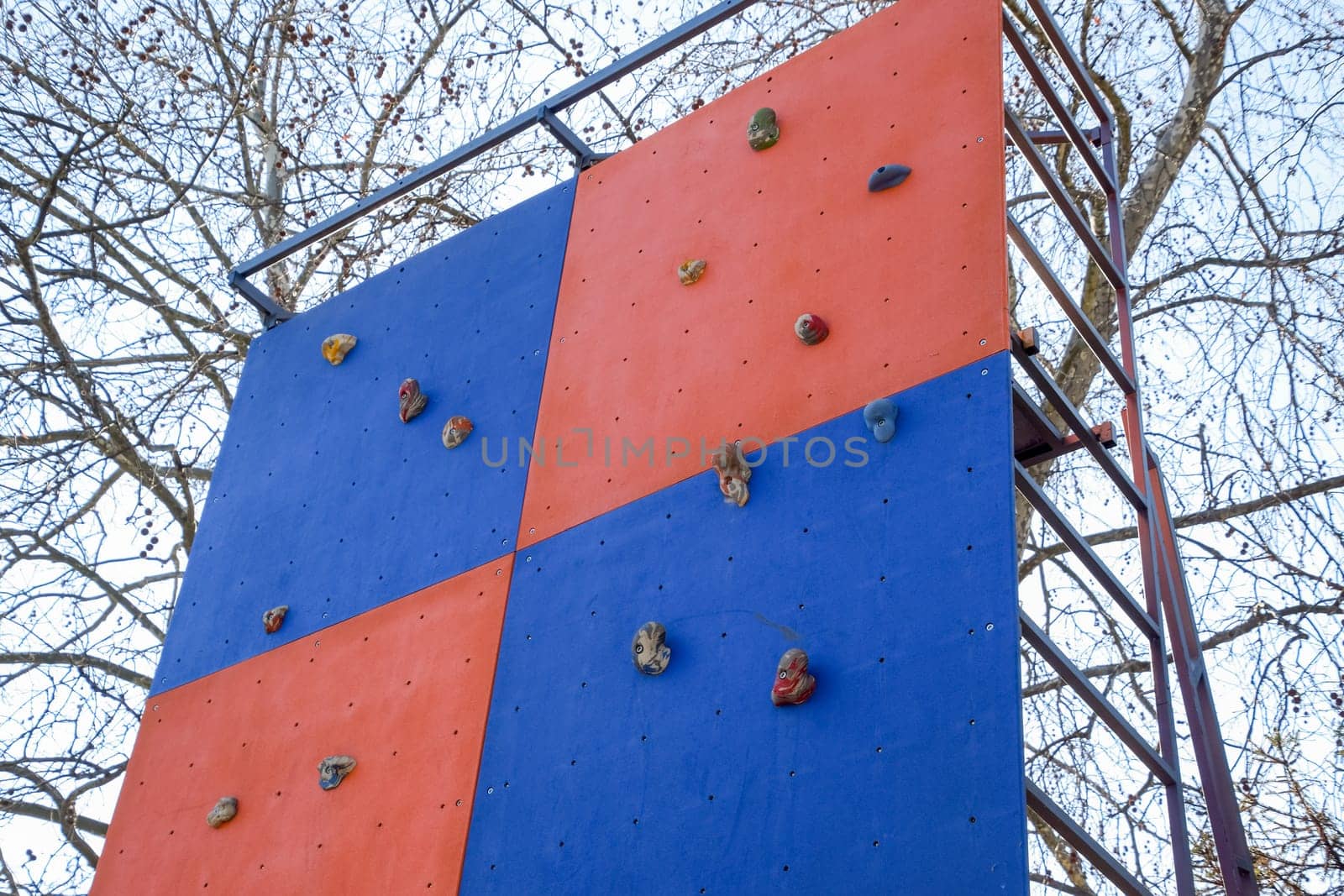 A wall to train climbers. Artificial stones are ledges on the wall.