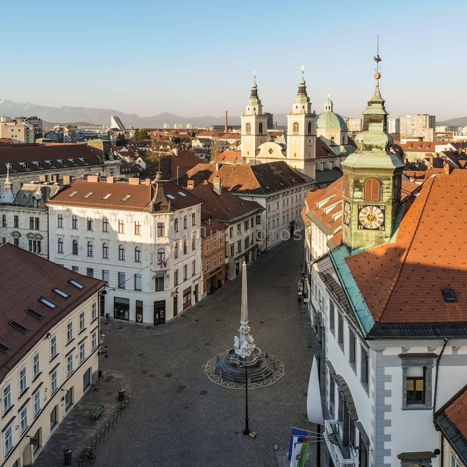 Panoramic aerial view of Town Square in Ljubljana, capital of Slovenia, at sunset. Empty streets of Slovenian capital during corona virus pandemic social distancing measures in 2020.