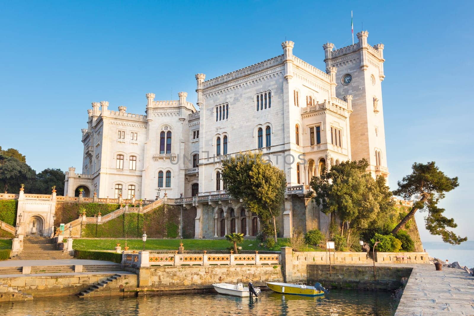 Miramare Castle or Castello di Miramare in sunset. It is a 19th century castle on the Gulf of Trieste near Trieste, Italy.