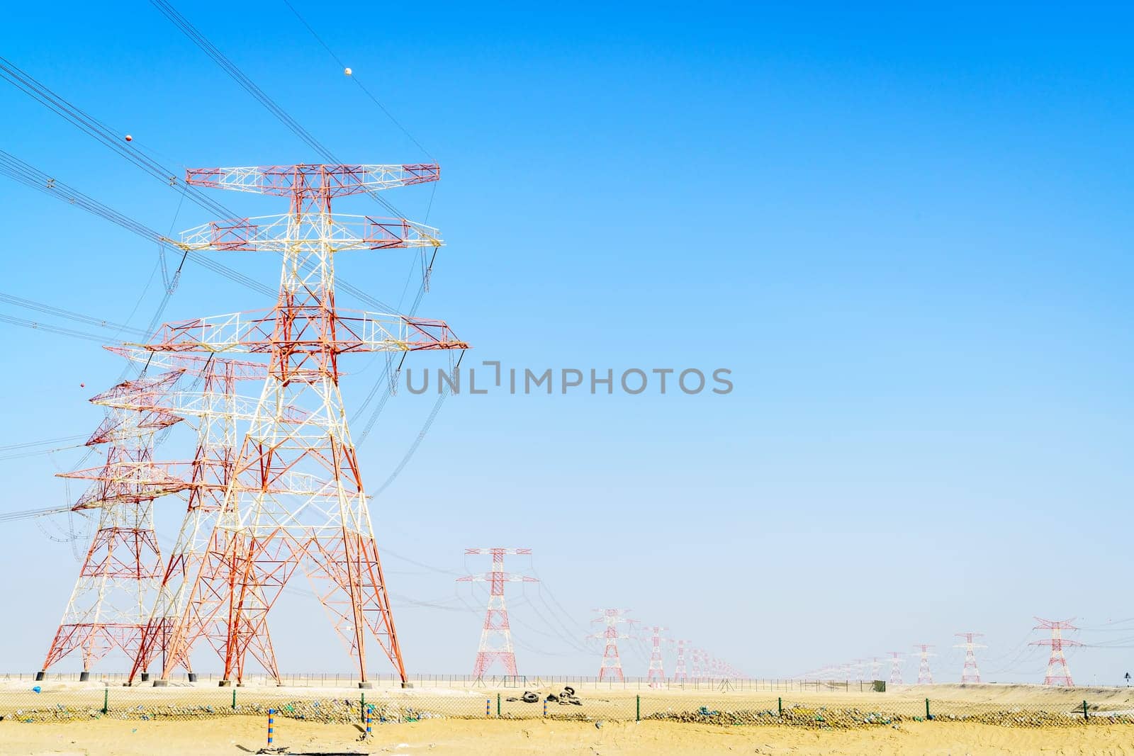 High voltage overhead transmission lines in Abu Dhabi desert