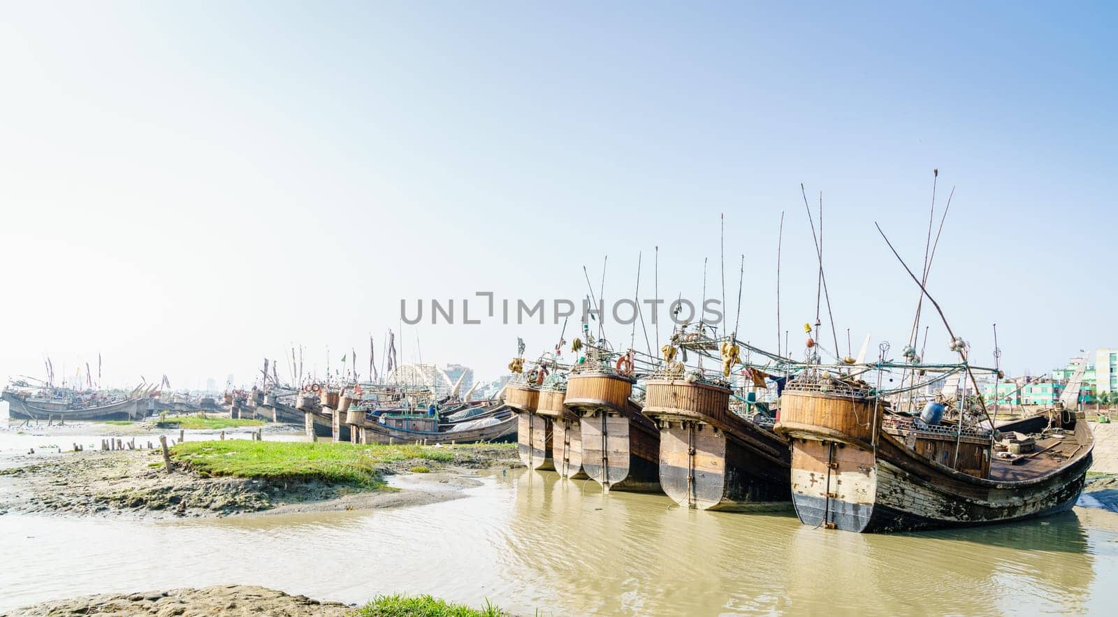 Traditional fishing boats in a port on Karnaphuli River in Chittagong, Bangladesh