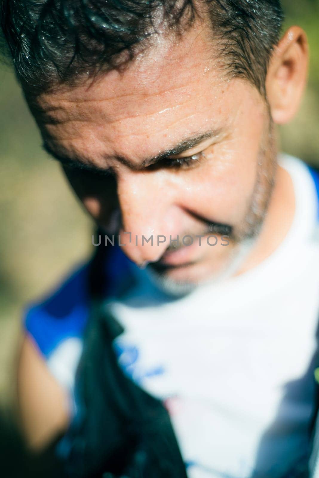 Photography session of trail runner runnig in the middle of nature and in the mountains. Preparing and interviewing
