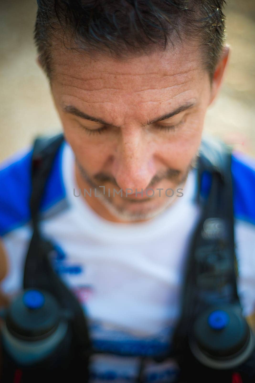 Photography session of trail runner runnig in the middle of nature and in the mountains. Preparing and interviewing