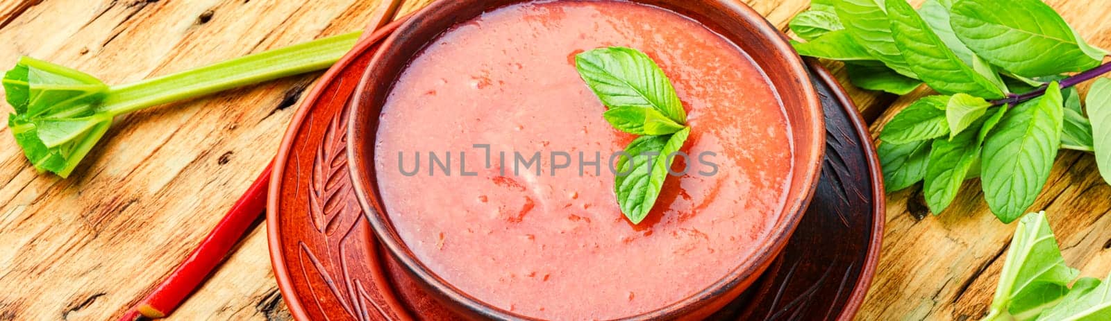 Summer cold rhubarb soup in a plate
