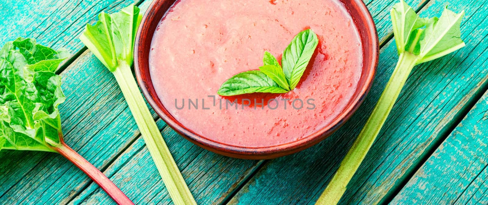 Summer cold rhubarb soup in a plate