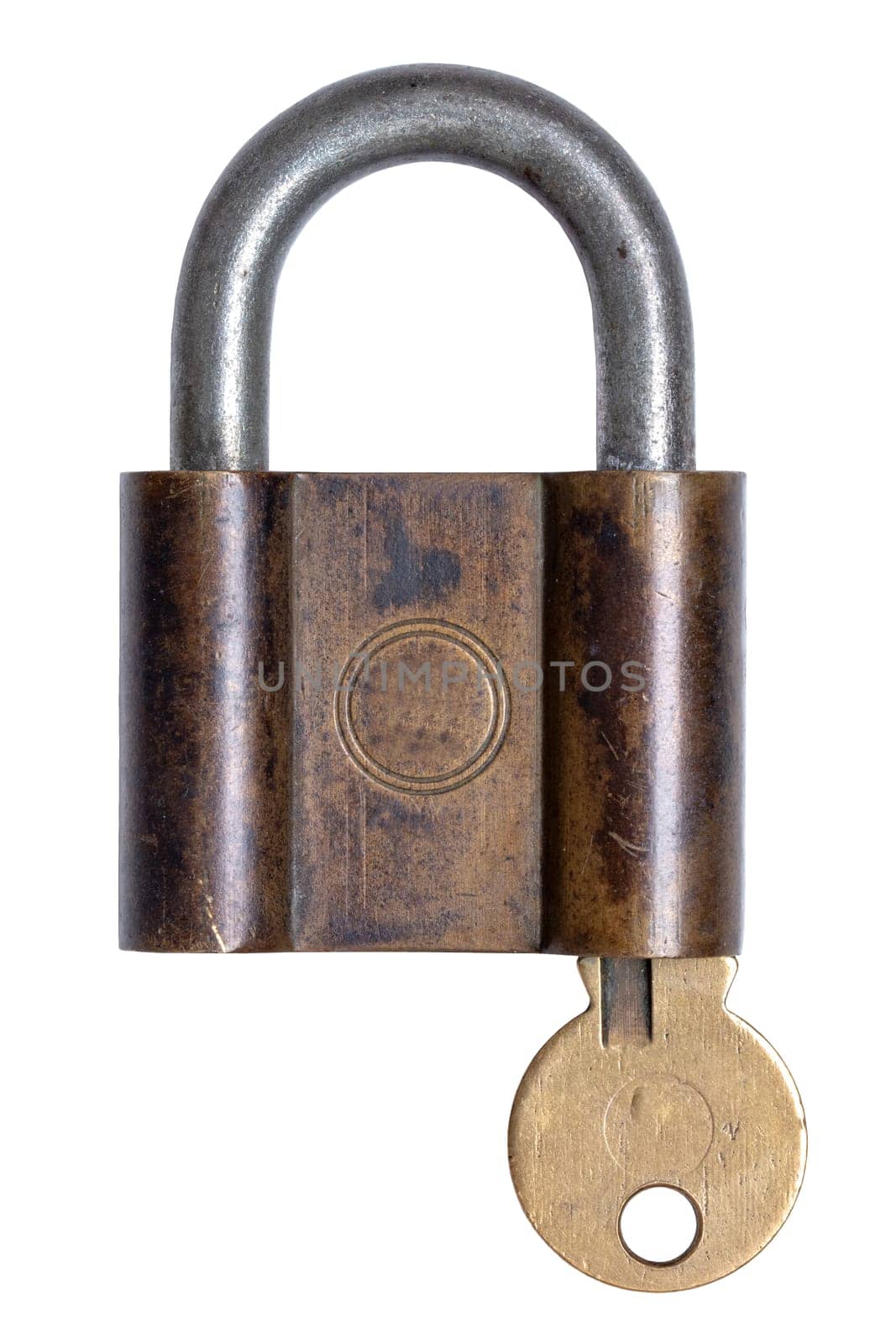 Lock and keys. Closeup of a old brass padlock with key inside isolated on a white background. Macro photograph of antique metal lock.