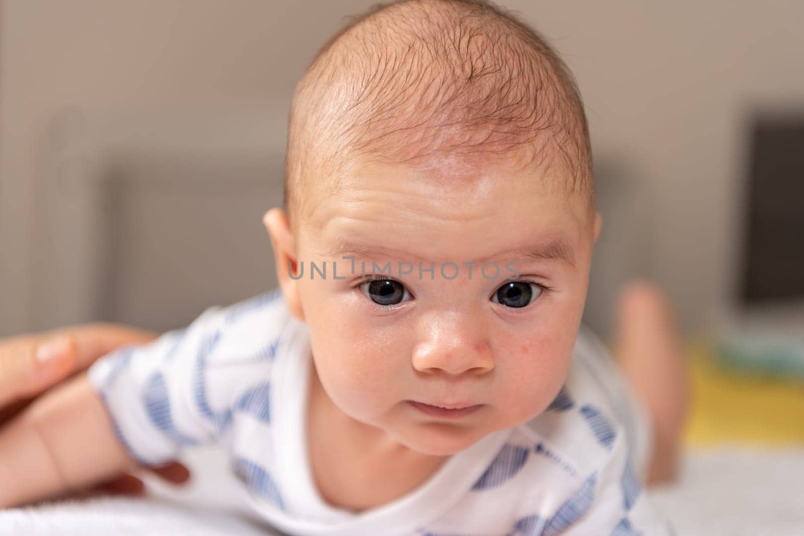 Adorable little baby boy during tummy time