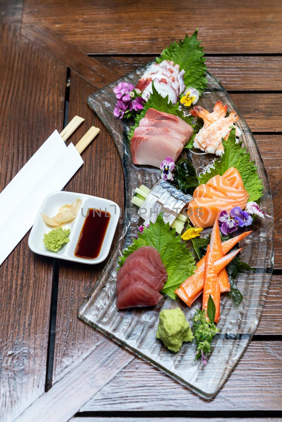 Variety of gourmet Sashimi set japanese freshness cuisine Salmon Tuna Otoro Saba Hamachi Octopus and shrimp meat. Restaurant gastronomy food and drink consumerism concept.