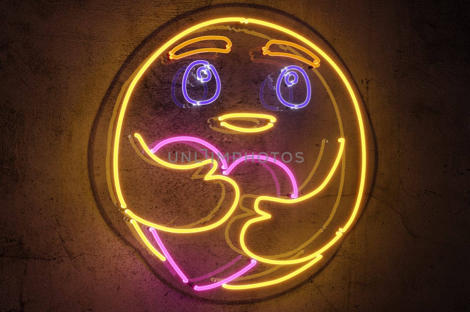 3d rendering  , Neon sign background " Care Emoji "" Sign hanging on a wall and lit brightly."