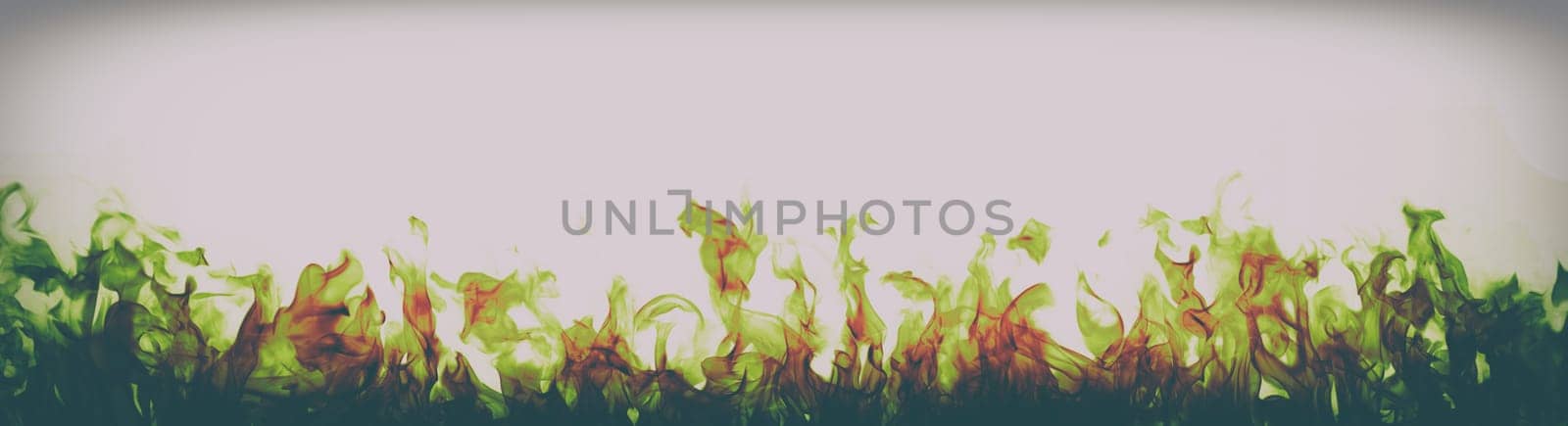 green and red fire flames on white background