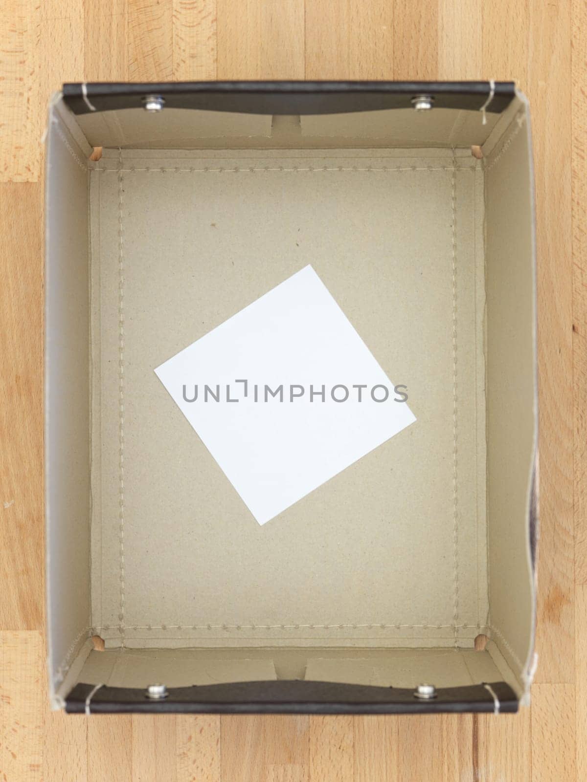 Storage boxes isolated on a wooden shelf