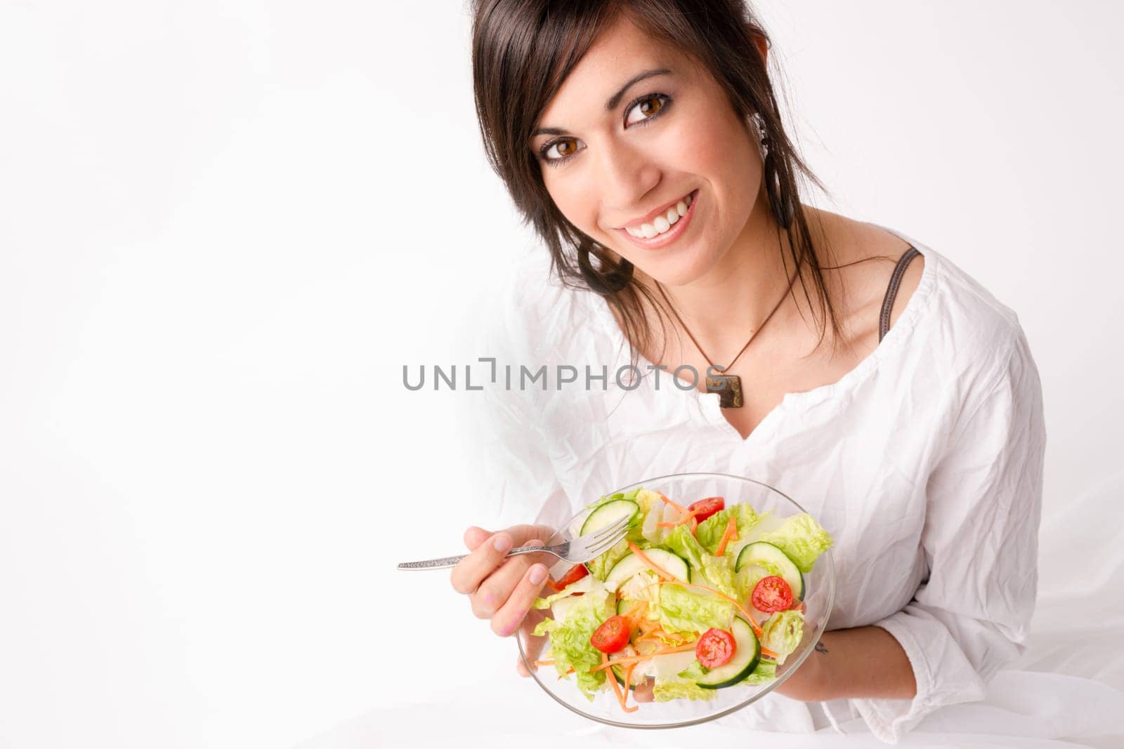 An attractive woman takes a moment to look at the camera before lunch