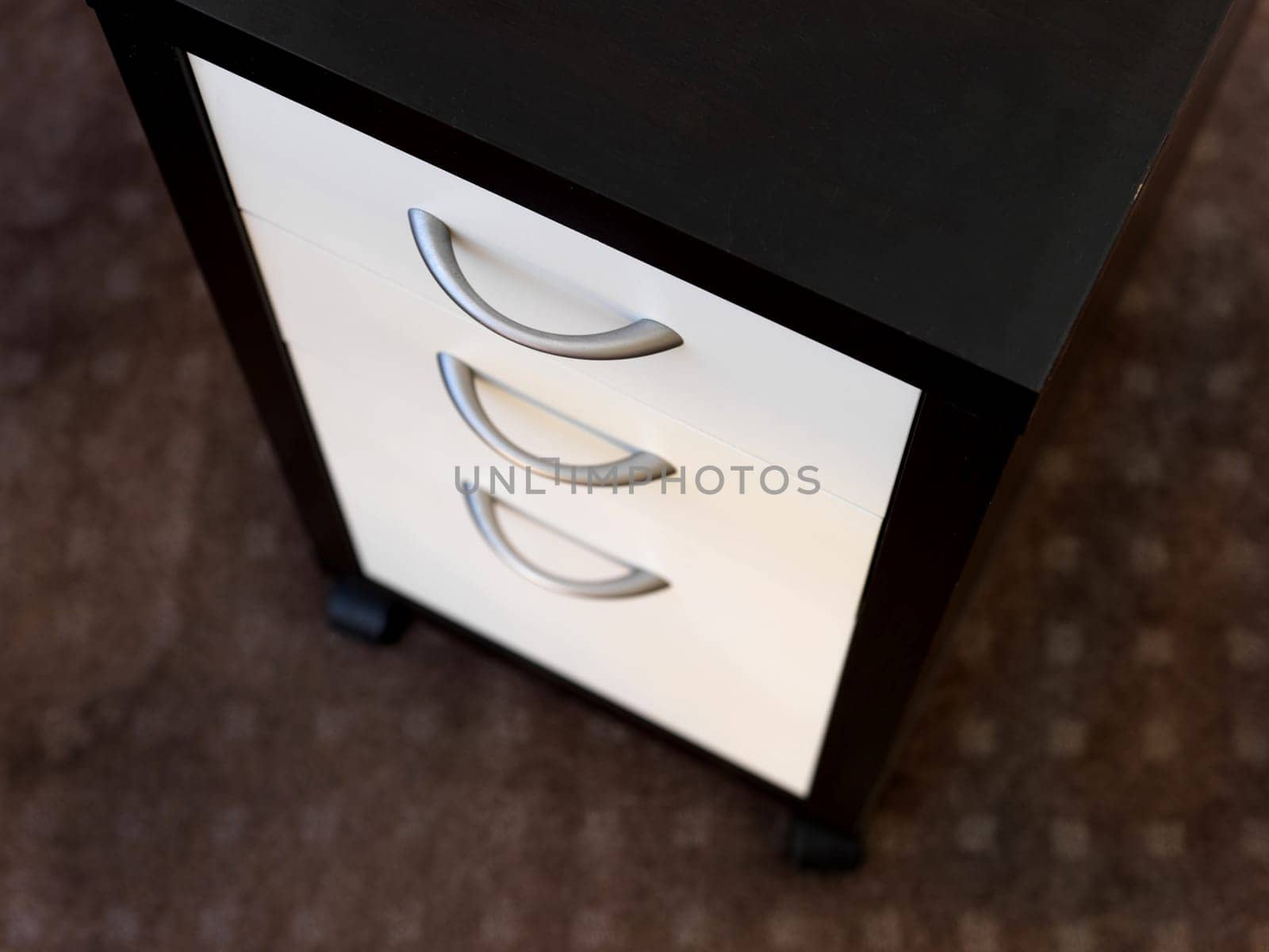 A close up shot of a set of office drawers