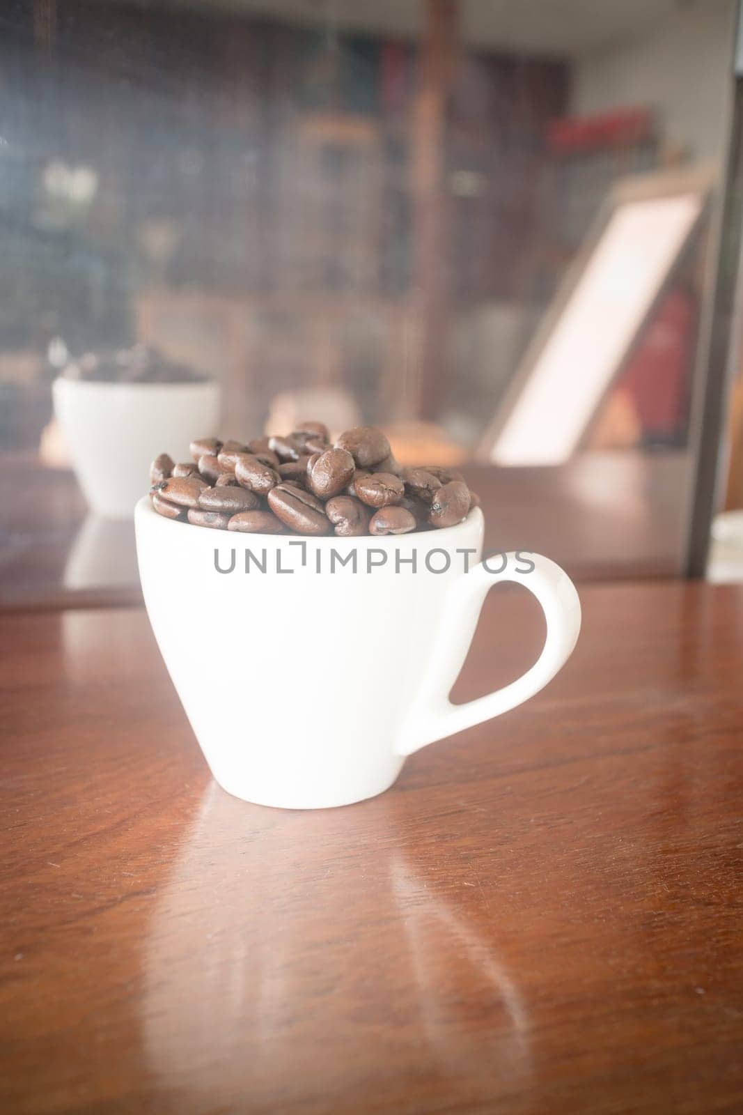 Roast coffee bean in white mug, stock photo