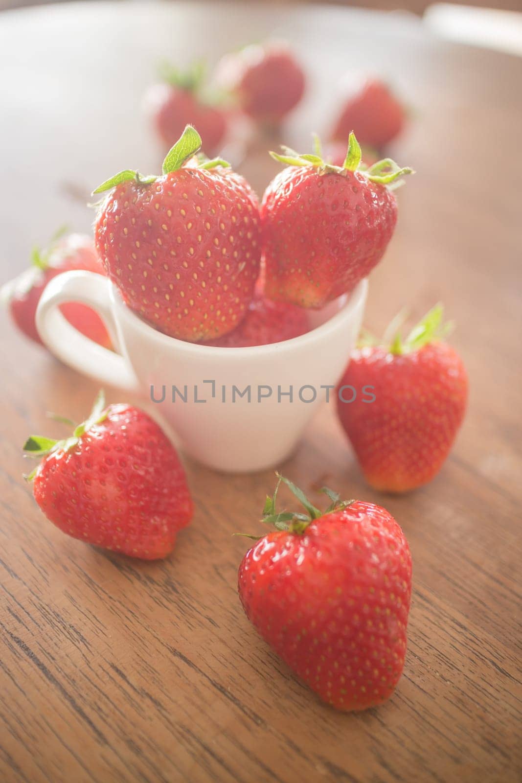 Fresh ripe strawberries on wooden background, stock photo