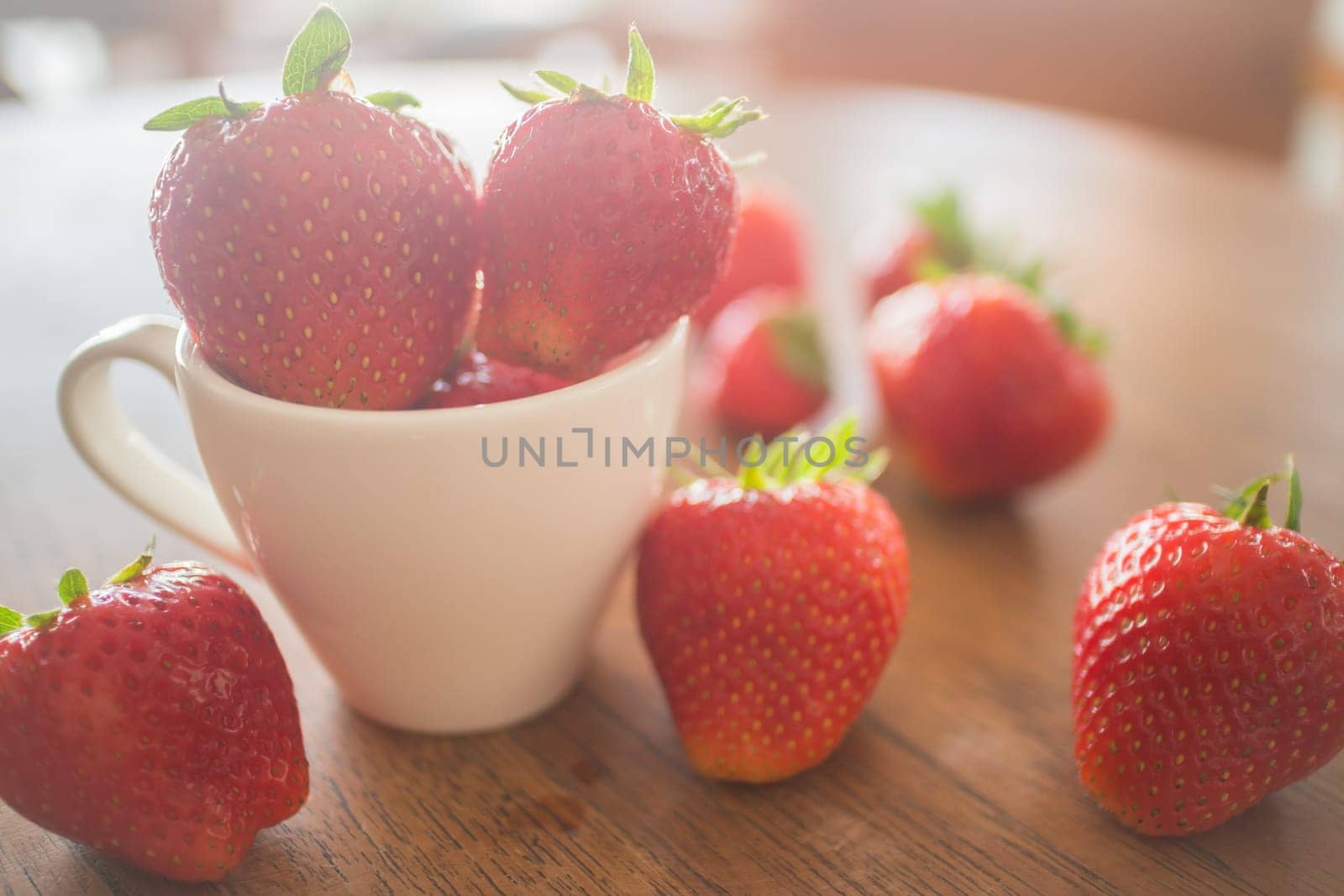 Fresh ripe strawberries on wooden background, stock photo