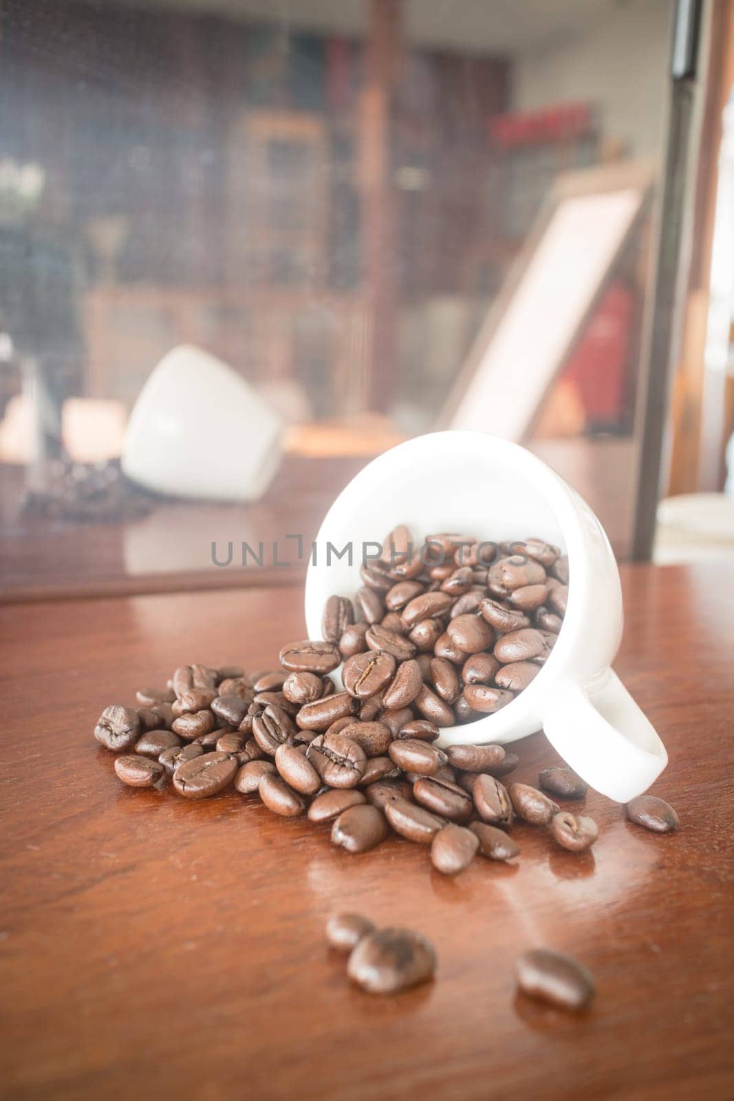 Roast coffee bean in white mug, stock photo