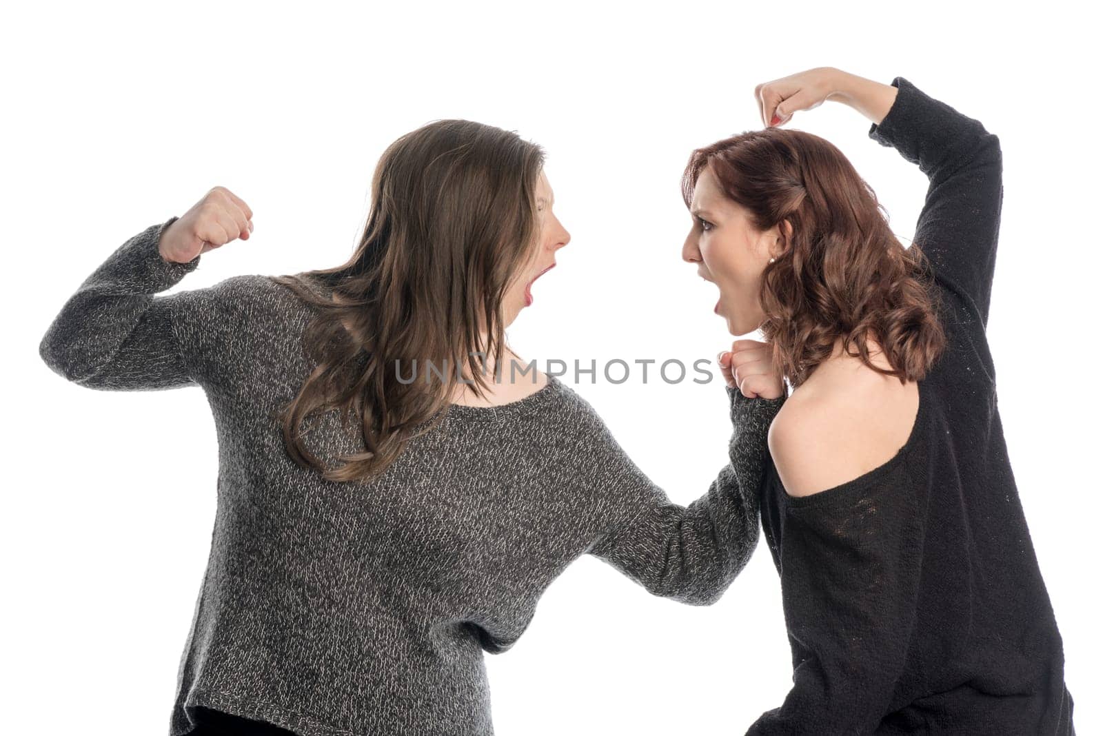 Two girls hit each other