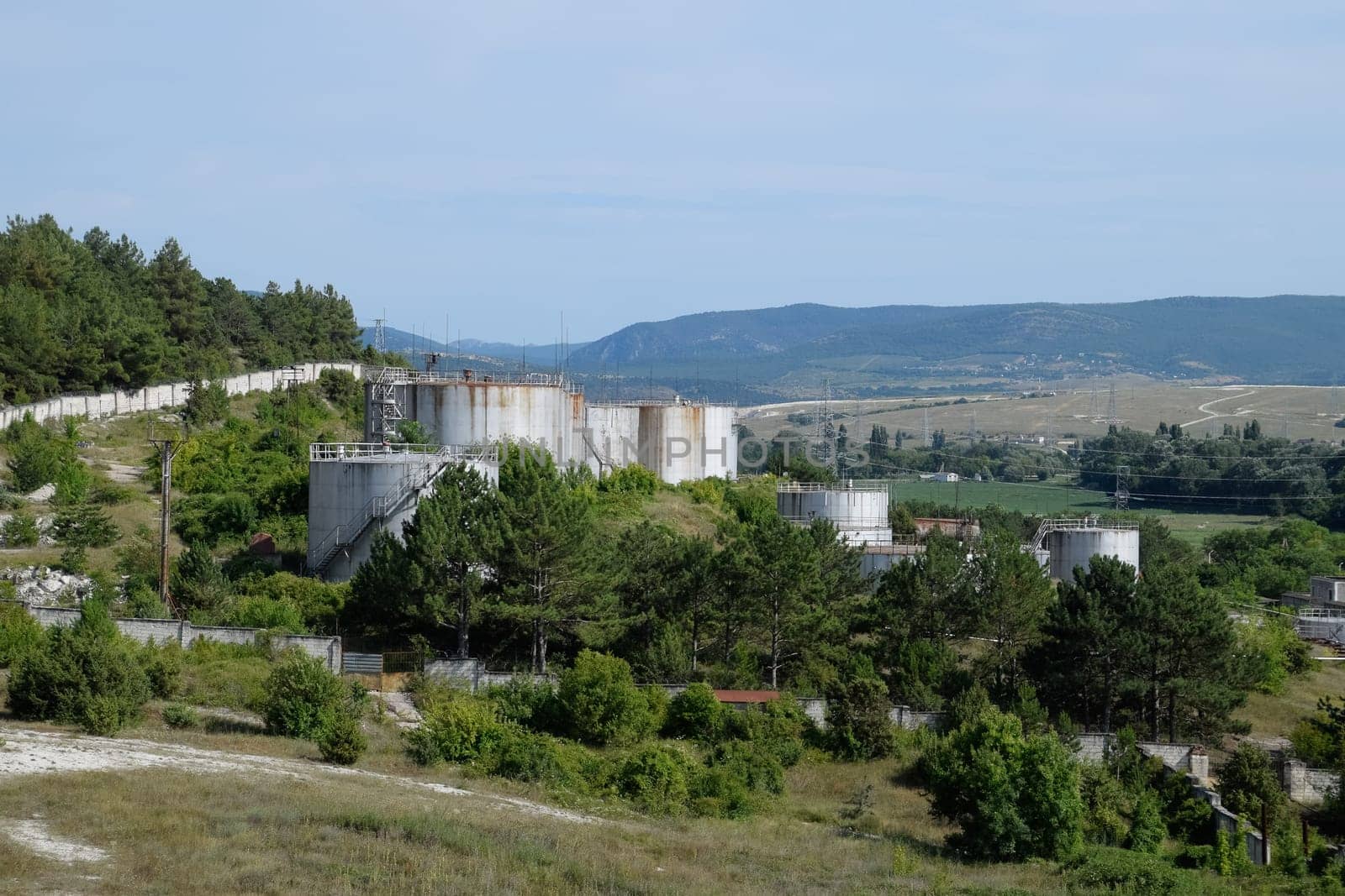 Oil storage tanks at the oil depot. reservoir vertical steel.