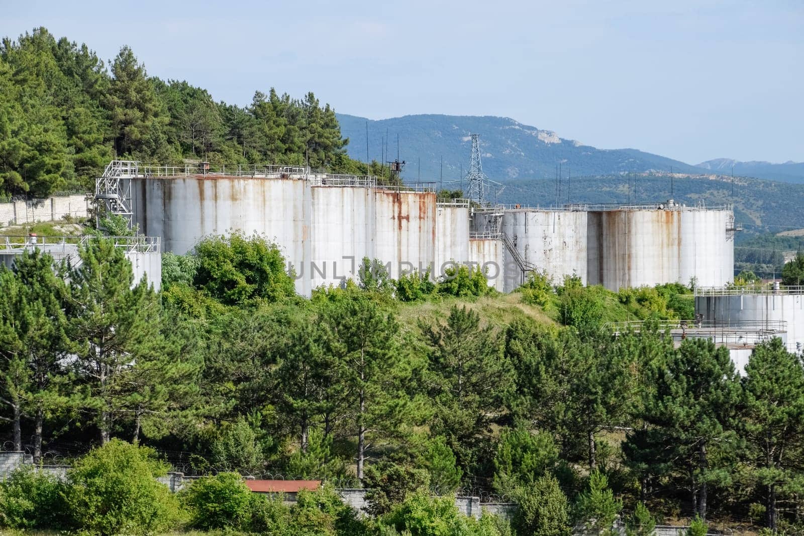 Oil storage tanks at the oil depot. reservoir vertical steel.