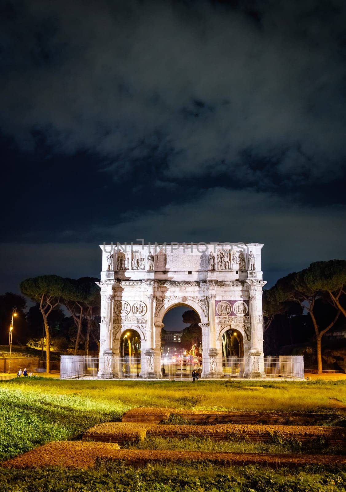 Nighttime view of the Arch of Constantine in Rome, Italy