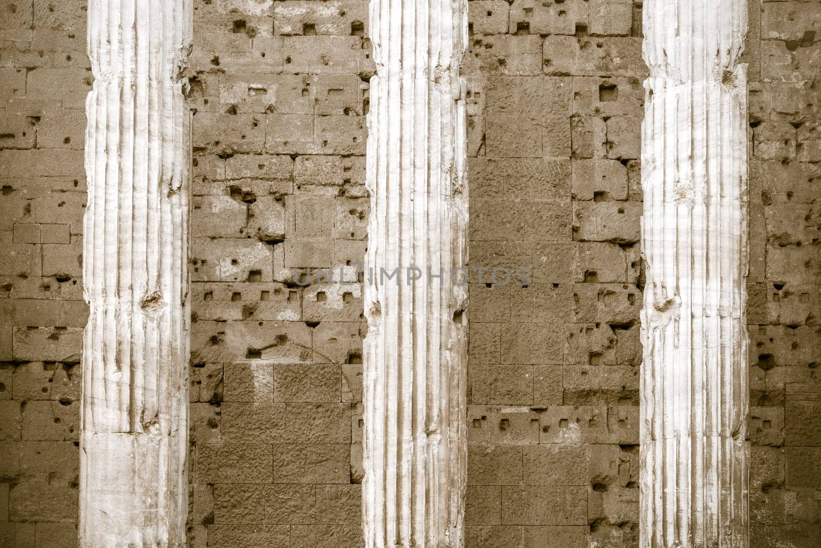 Details of columns of Temple of Hadrian facade in Rome, Italy