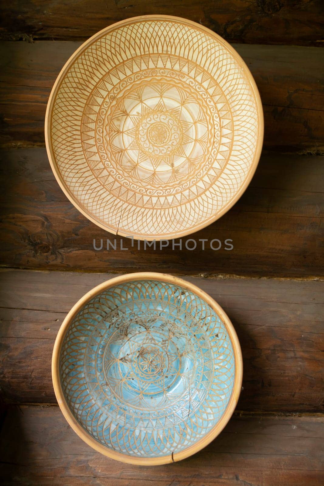Empty clay bowls on a wooden background. Authentic bowls of Belarus