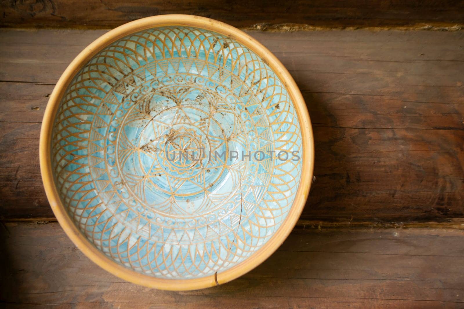 Typical ethnic porcelain bowl with floral and ornamentic pattern. Traditional souvenir from Belarus.