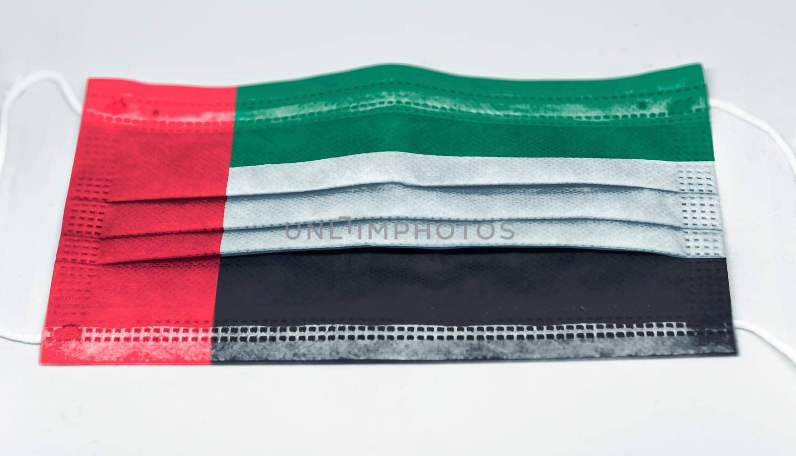 surgical mask with the national flag of Kuwait printed. Pandemic covid-19 and preventive measures to counter the spread of the virus