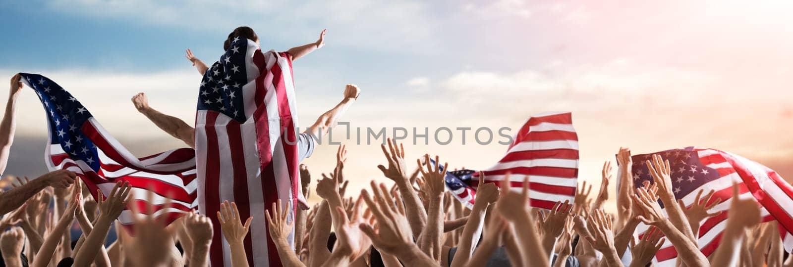 Fourth Of July Celebration. Little Girl Sitting On Dads Shoulders