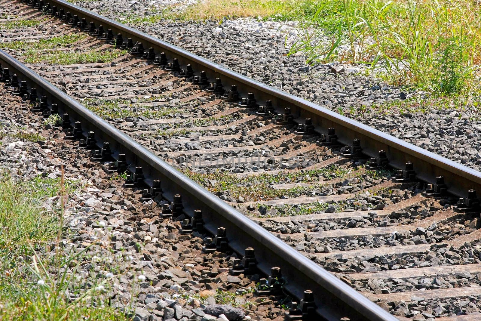 Close up shot of diagonal rail tracks.