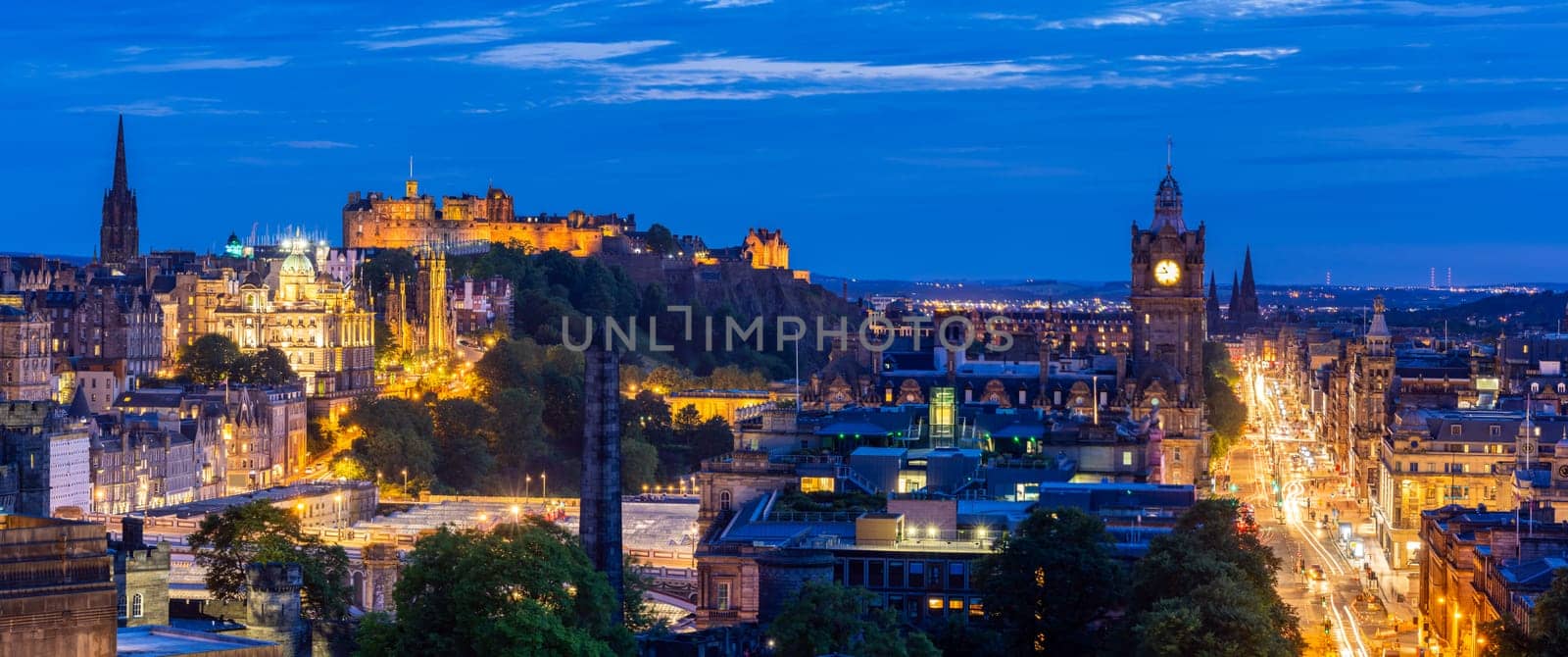 Night Panoramic of Edinburgh ancient old town Cityscape from Calton Hill sunset dusk, Edinburgh, Scotland UK, Web banner crop. Landmark cityscape and tourism concept.