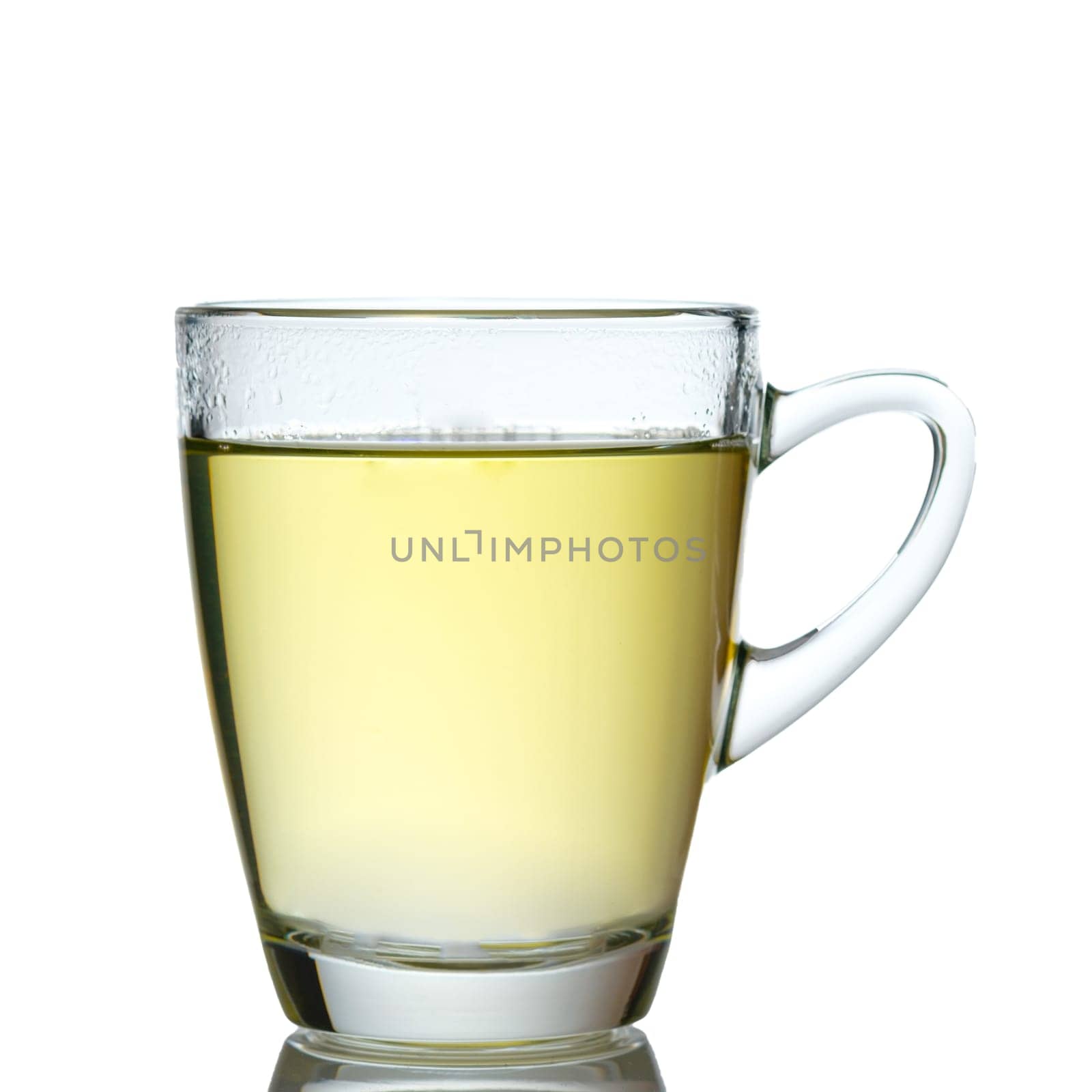 Glass mug of green tea white isolated in back lit