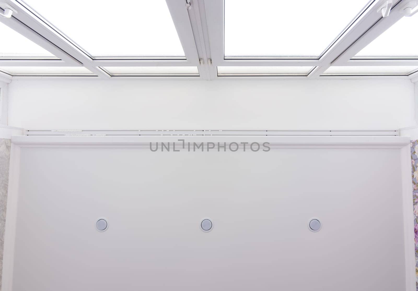 Contact of a stretch ceiling to a wide stained-glass window