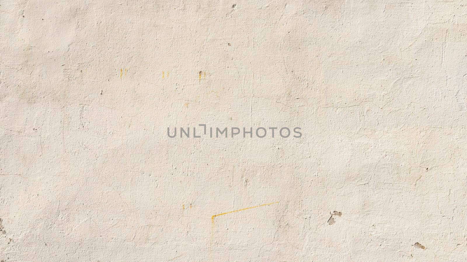 Beige painted wall texture, grungy background with some stains and small cracks.