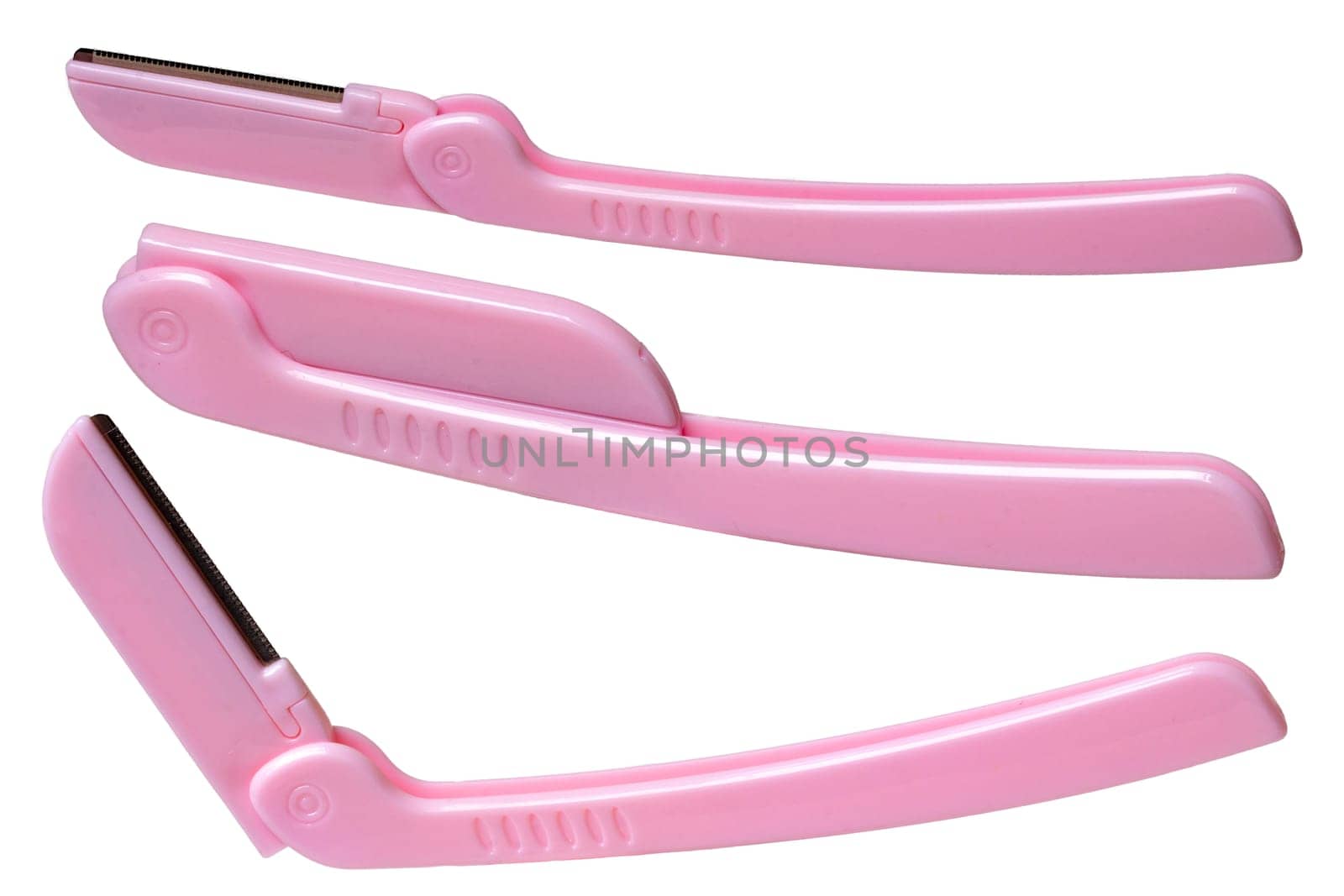 Cosmetic tools. Close-up of a pink eyebrow razor isolated on a white background. Beauty concept. Macro in three different views.