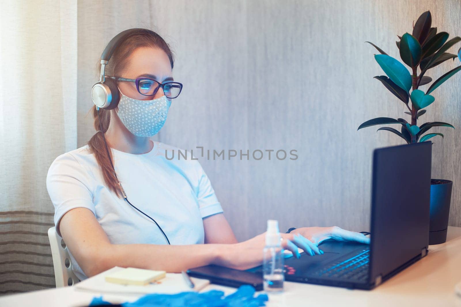 Coronavirus protective concept. Woman in office working with laptop