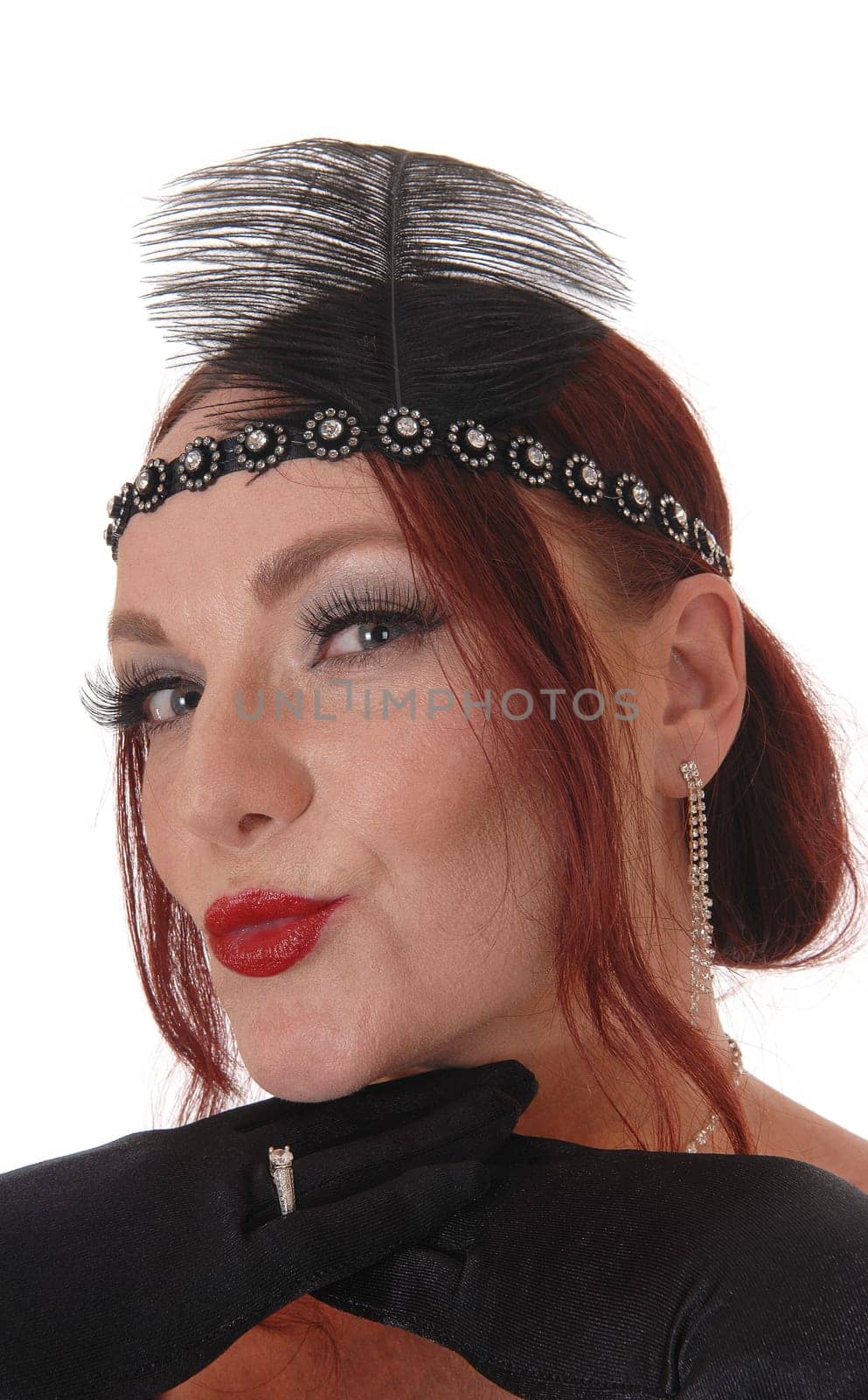 A close up portrait image of beautiful woman with her red hear .smiling and giving a kiss, isolated for white background.