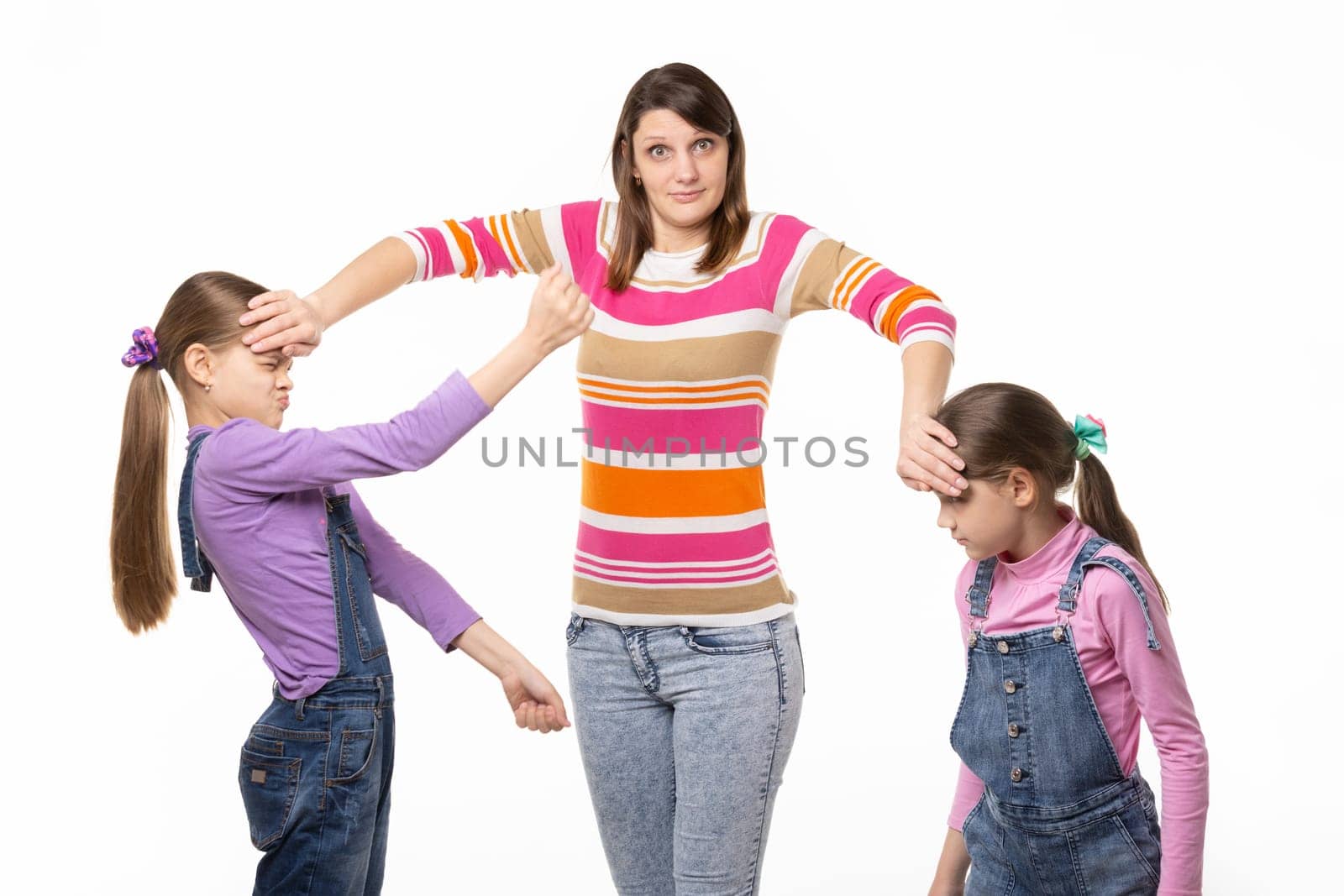 Girl trying to separate the fighting children, isolated on white background