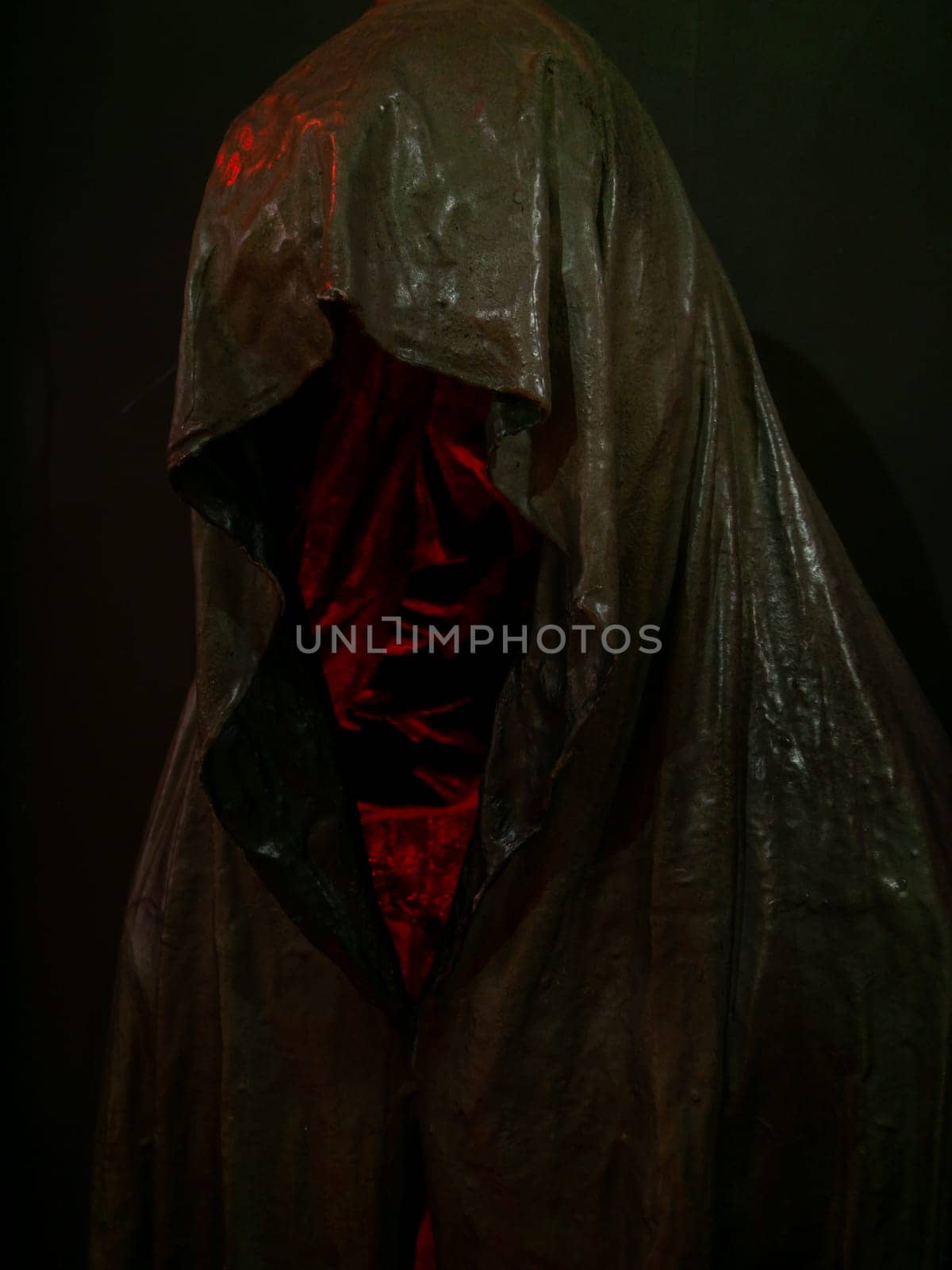 Ghost Tours, Skeleton holding in hood  against structure at night. Halloween, Ghost stories and Ghost tours.