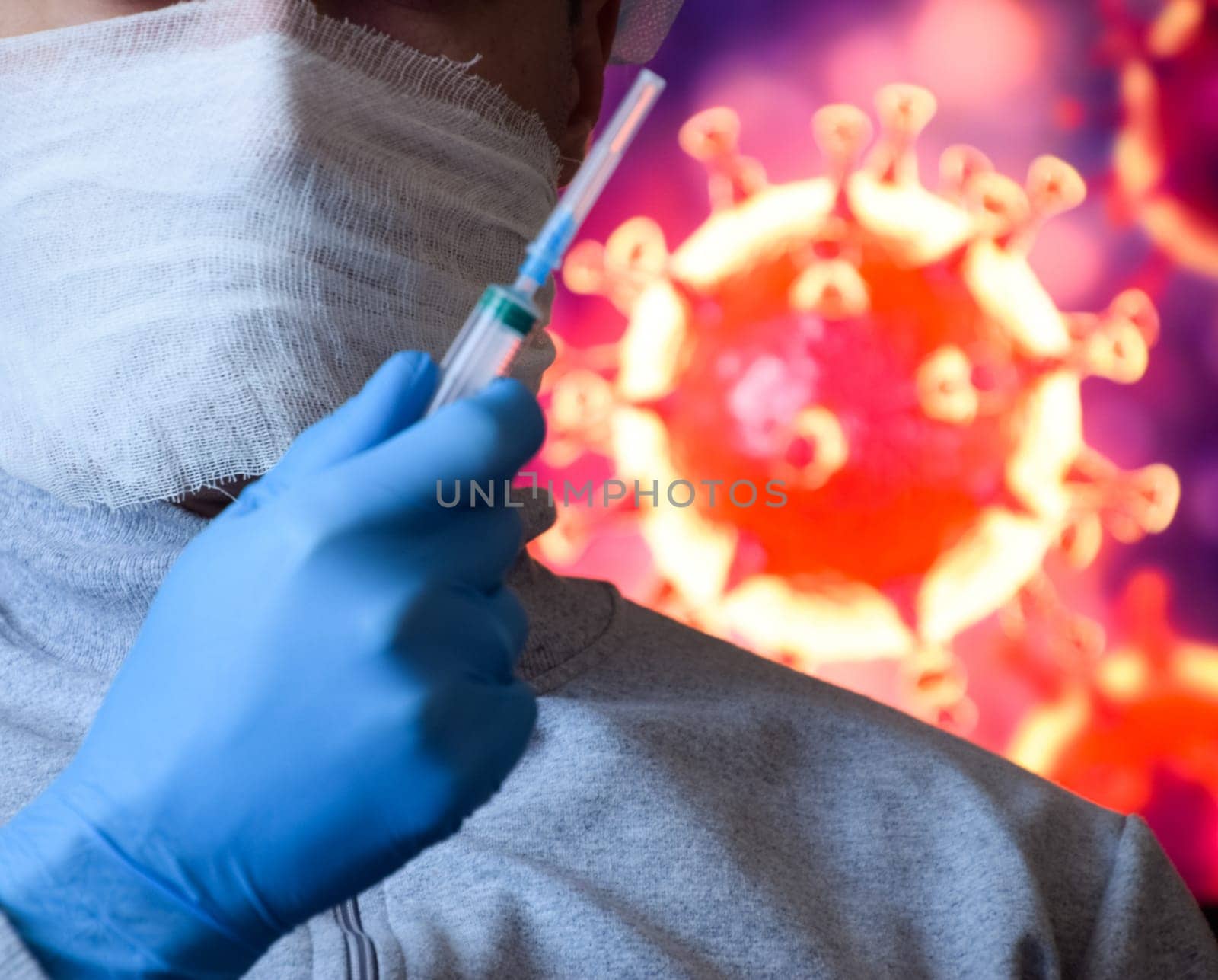 A man in a mask and protective gloves on the background of the image of a coronavirus. Doctor with a vaccine and a syringe.