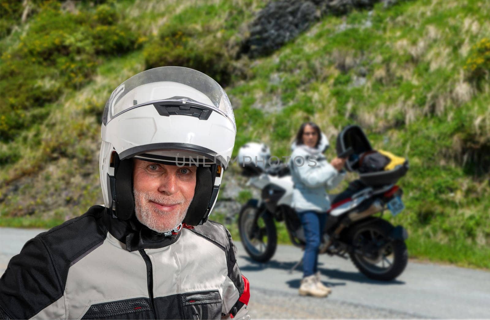 portrait of senior biker with white helmet