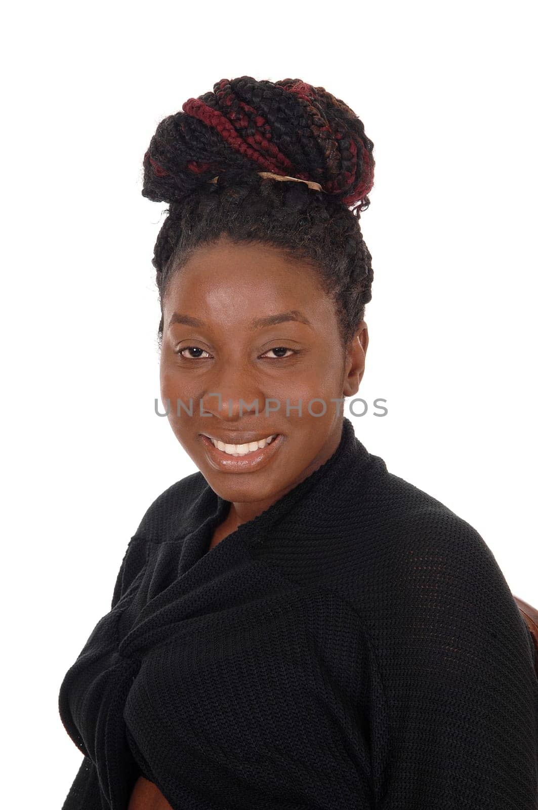 A close up image of an African American woman with her curly hair.as a bun on her head, smiling, isolated for white background.