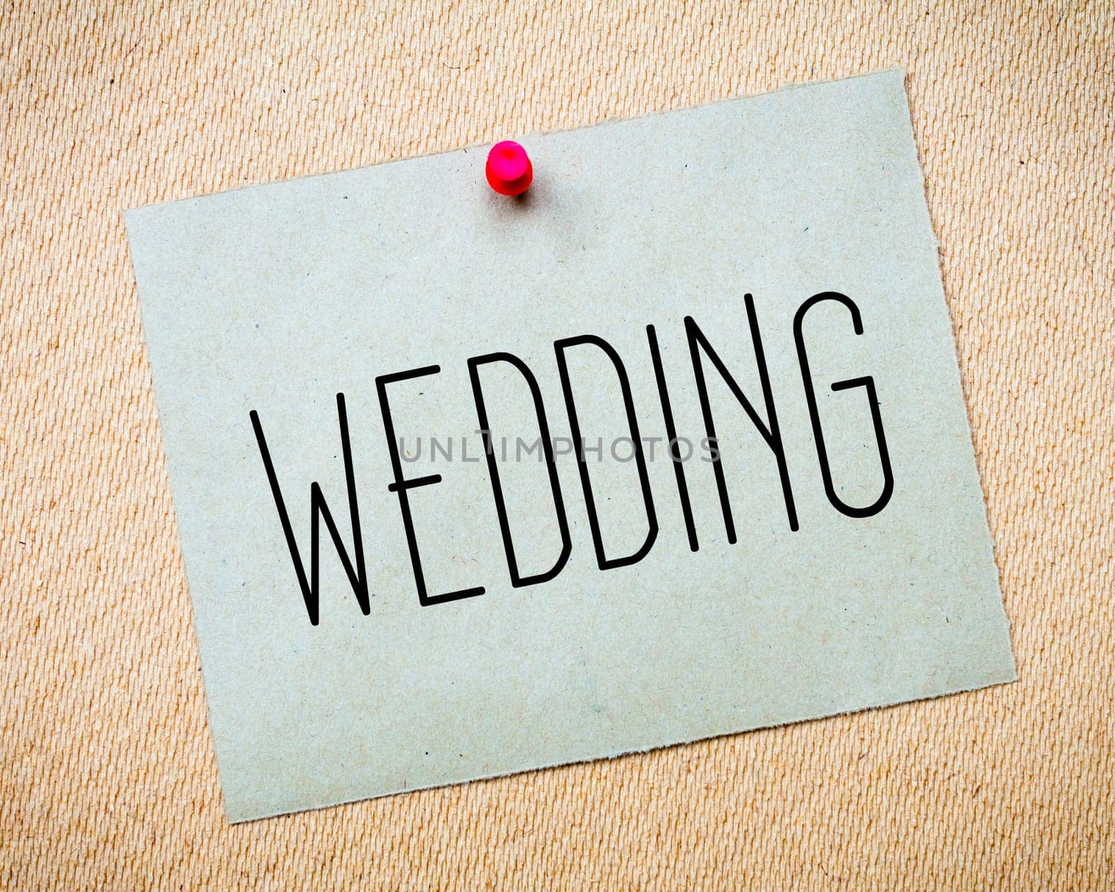 Recycled paper note pinned on cork board.Wedding Message.Marriage Concept Image