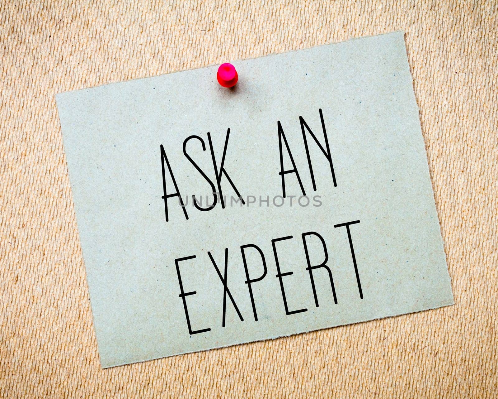 Recycled paper note pinned on cork board.Ask an Expert Message. Concept Image