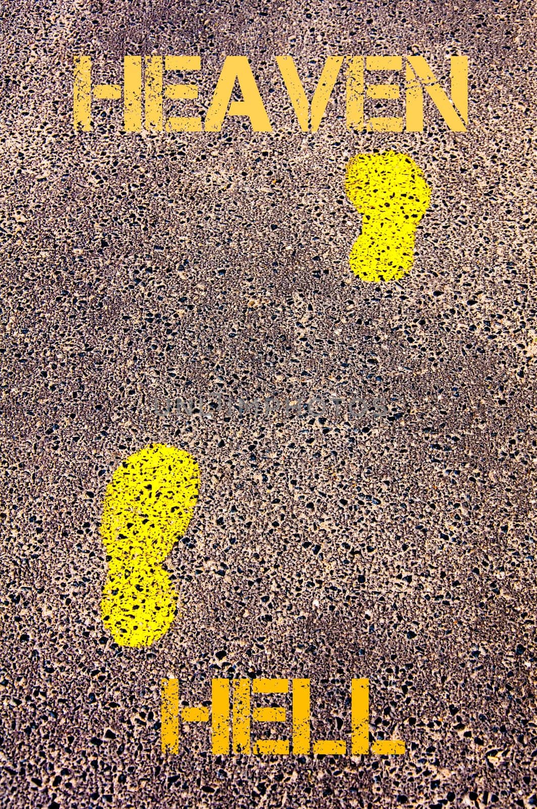 Yellow footsteps on sidewalk from Hell to Heaven message. Conceptual image