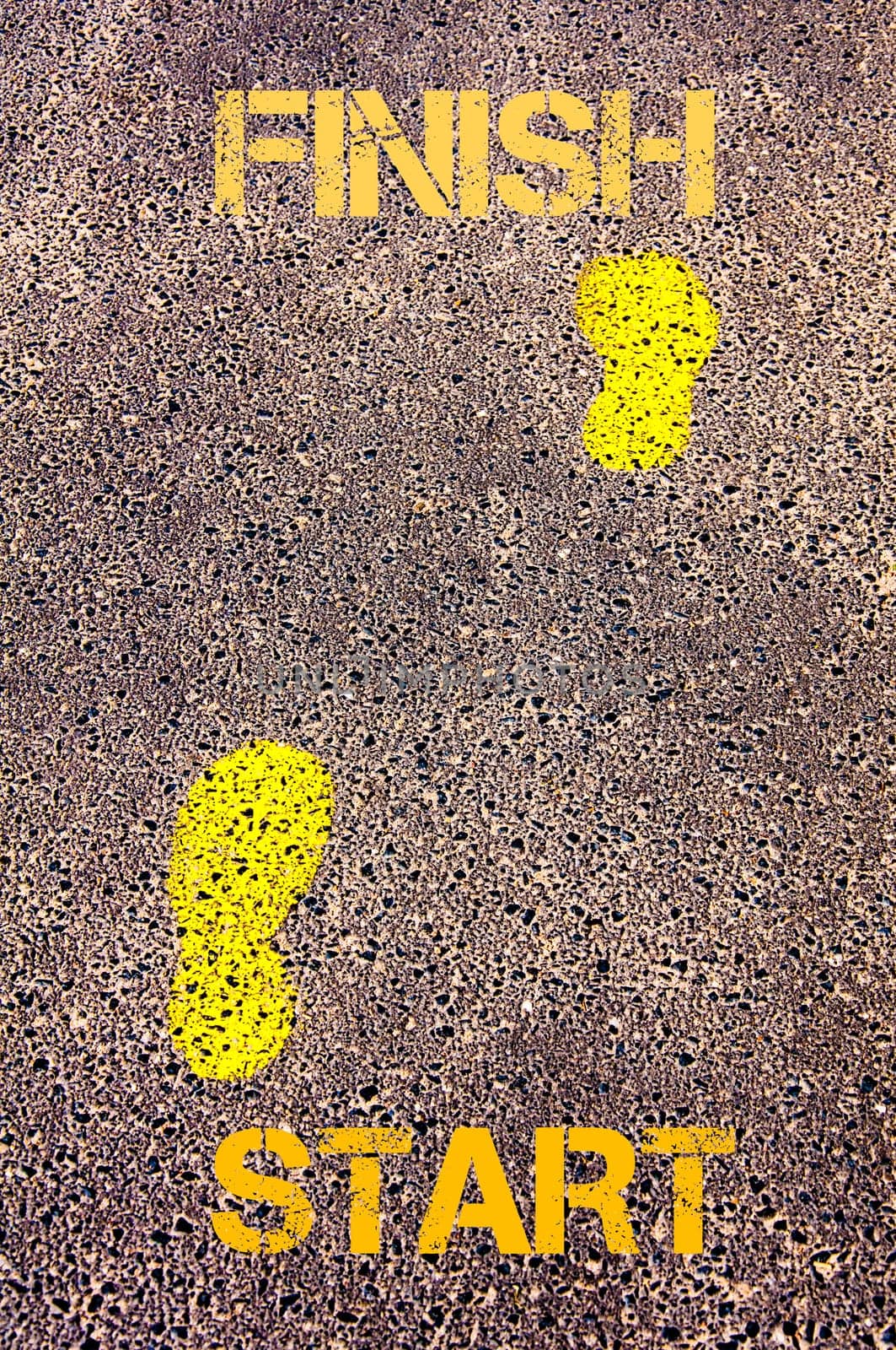 Yellow footsteps on sidewalk from Start to Finish message. Conceptual image